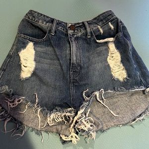 high waisted blue jean shorts, have been helmed at the waist
